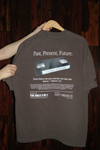 Load image into Gallery viewer, Modern Brown VHS-themed Christian T-shirt with an oversized fit and nostalgic back graphic that may remind you of an old newspaper ad. Theme is based on Hebrews 13:8 that says, "Jesus Christ is the same yesterday today and forever." Edit alt text